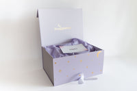 Snugglebox branded box with a card inside on a white background
